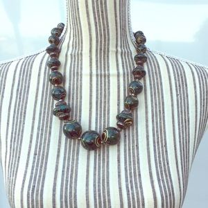 Silver and green hand-painted, beaded necklace.